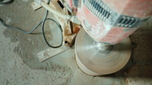 Powerful power tool drills a hole in a concrete ceiling