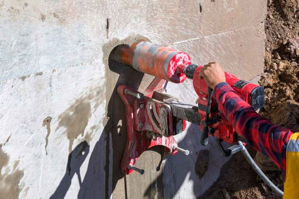 A construction worker used a drill to cut through a wall at a construction site in Texas & Louisiana